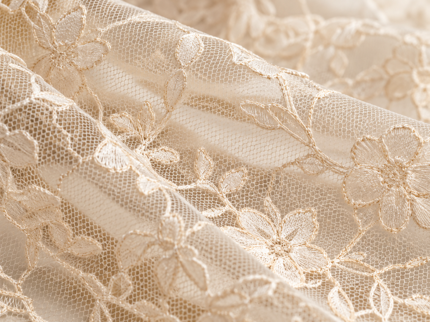 Ivory lace detail showing open spaces between fine interlaced threads