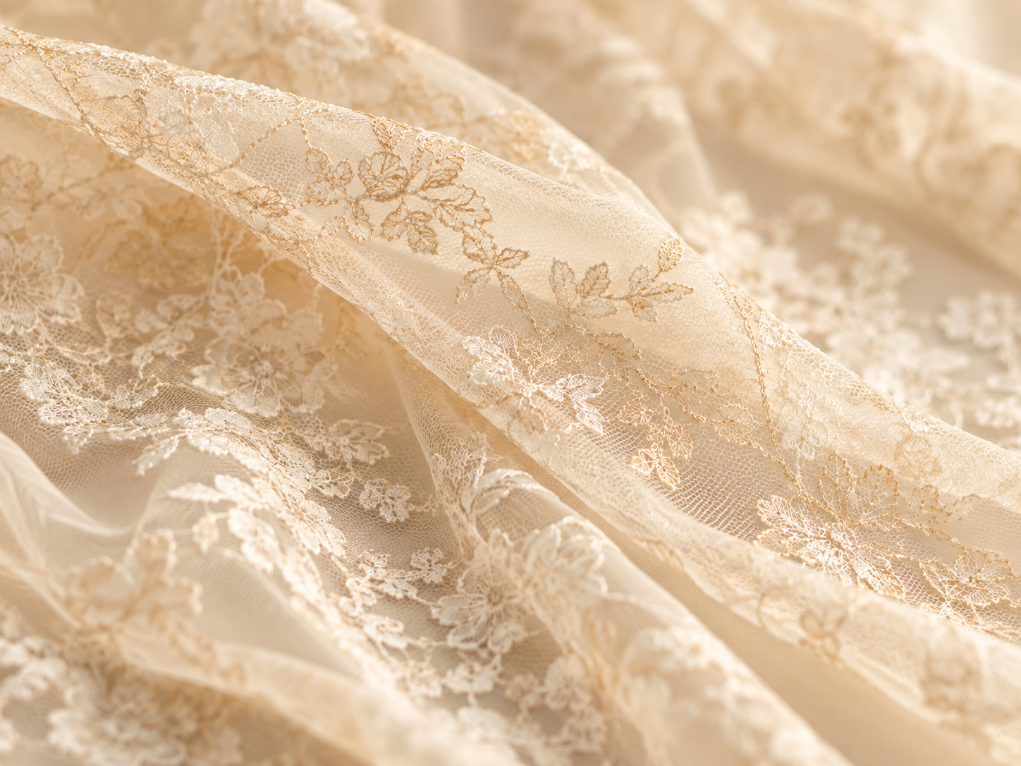 Fine ivory lace threadwork across the folds of an open textile surface